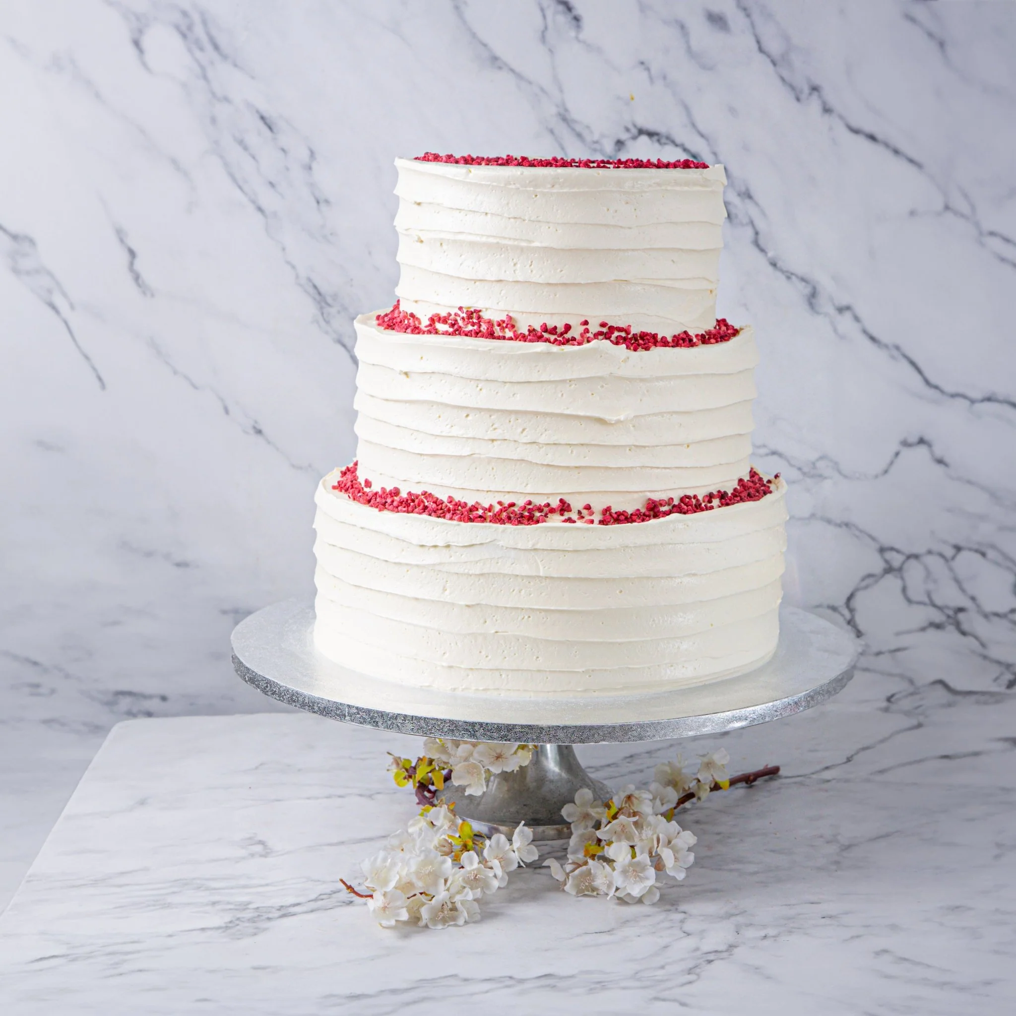 Hello , how much is velvet wedding cake if it is two tier and for 40-50 guests and how much is delivery to north L
