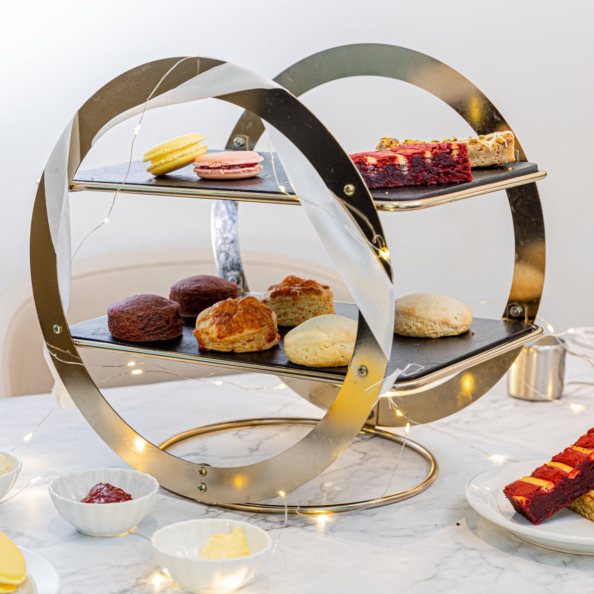 How were sweet treats introduced to the traditional Afternoon Tea