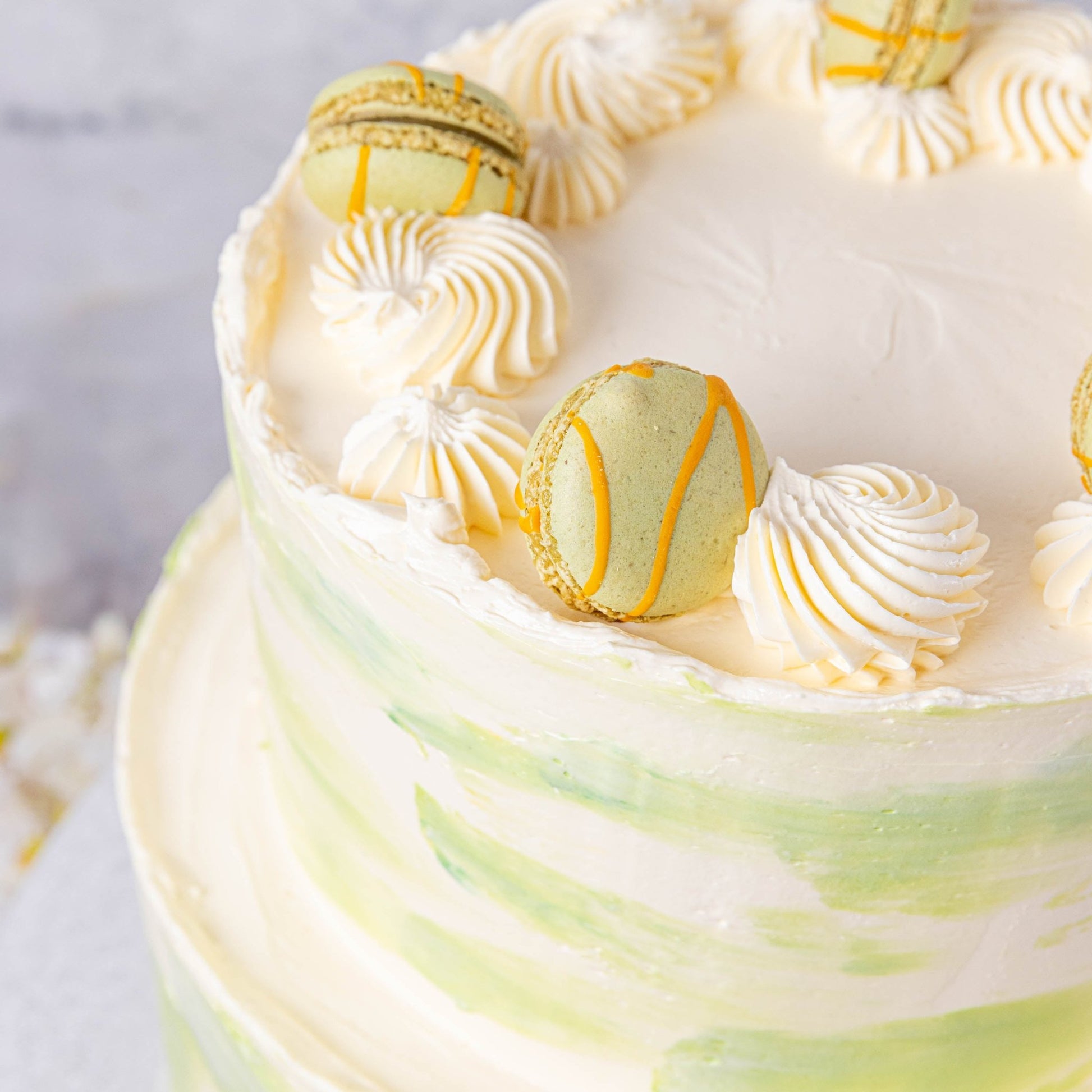 Ombré Buttercream & Macarons Wedding Cake - Jack and Beyond