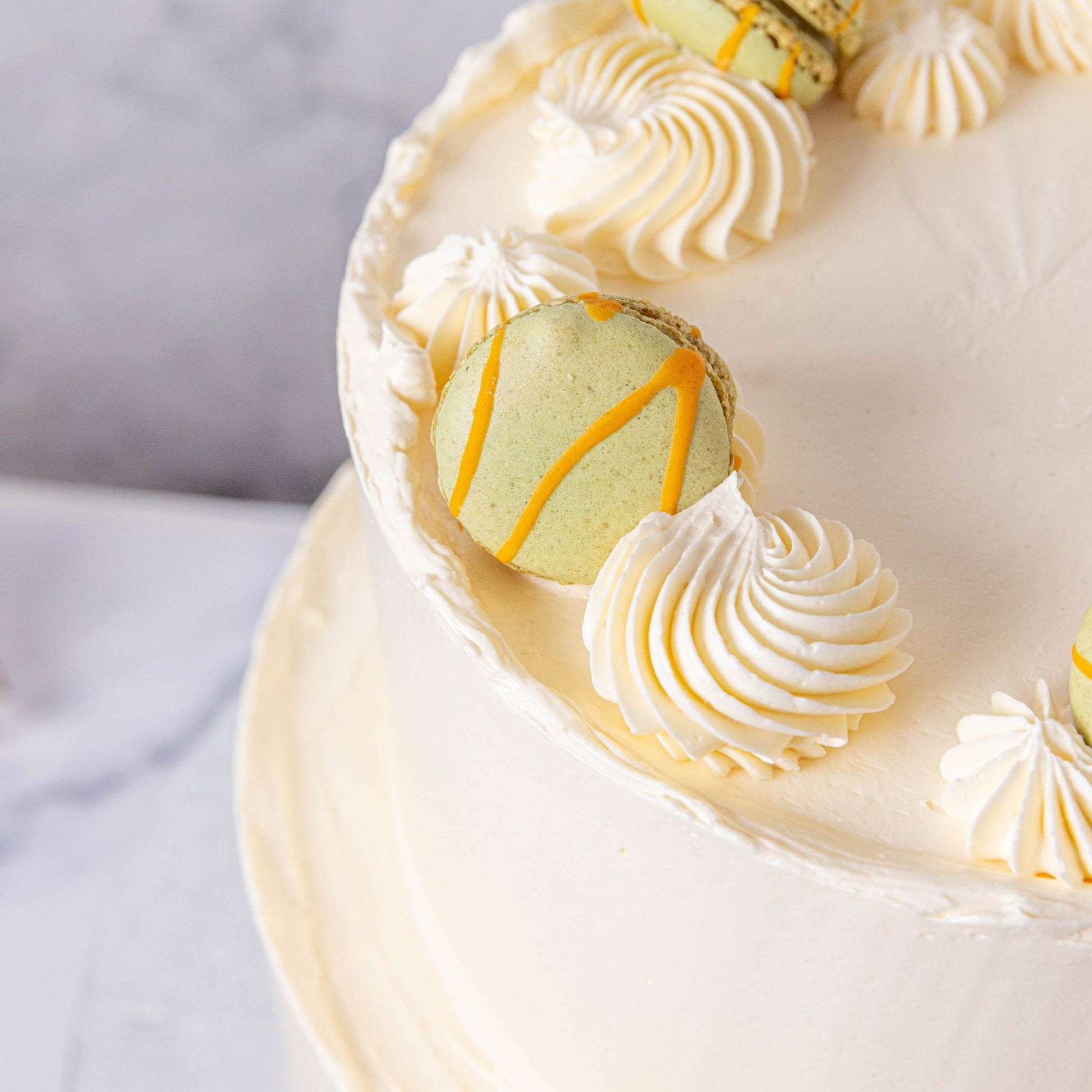 White Buttercream & Macarons Wedding Cake - Jack and Beyond